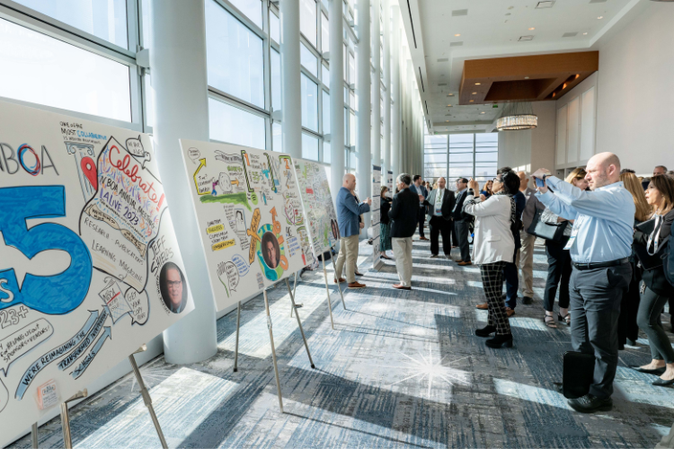 Annual Meeting attendees view custom illustrations