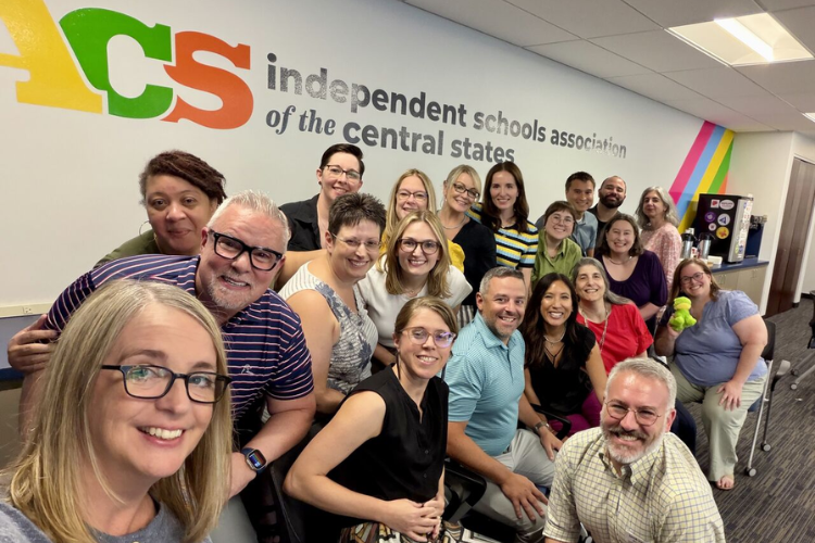 isacs NBOA staff gathers for a selfie at the ISACS classroom.