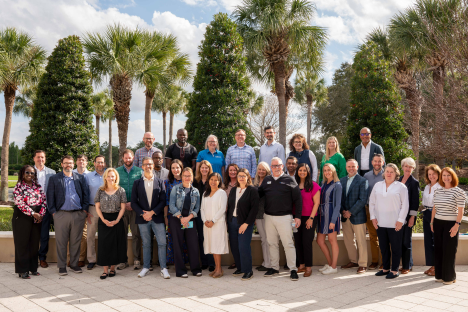 Dallas Joseph (top left) stands with the most recent Leadership Academy cohort